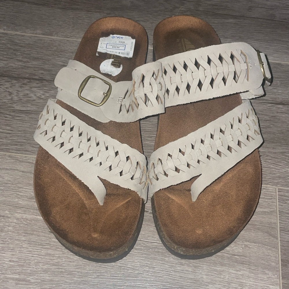 Women’s sandals cliffs by white mountain